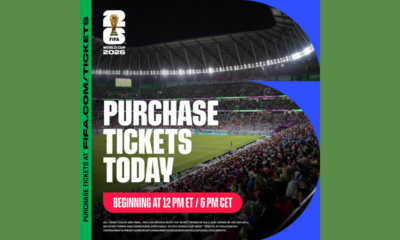 Poster promoting FIFA World Cup 2026 ticket sales with a stadium crowd and bold 'Purchase Tickets Today' text.