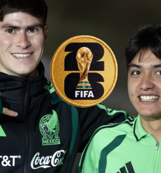 Two young Mexican soccer players pose with arms around each other, smiling, with a large FIFA World Cup patch centered between them.
