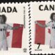 Two Canadian stamps feature a soccer player holding a Canadian flag, wearing a YETI jersey, with 'Nelson' and number 7 shown.
