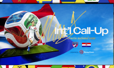 Poster for Croatia national team Int'l Call-Up with a giant soccer ball, a player in white kit on a small pitch, and a blue backdrop with flags and a gold autograph-like signature.