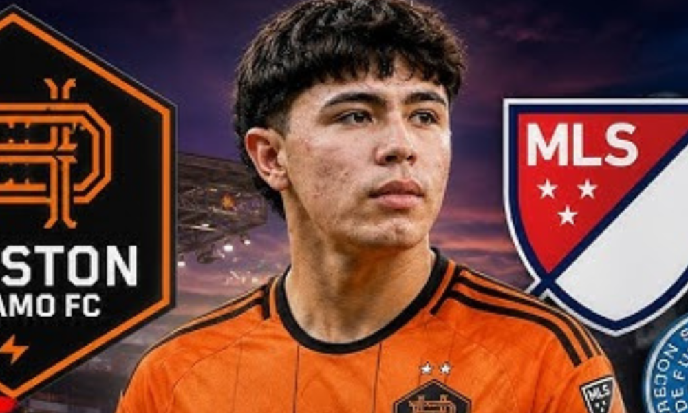 Portrait of a young soccer player in an orange Houston Dynamo FC jersey, with MLS logo in the background.